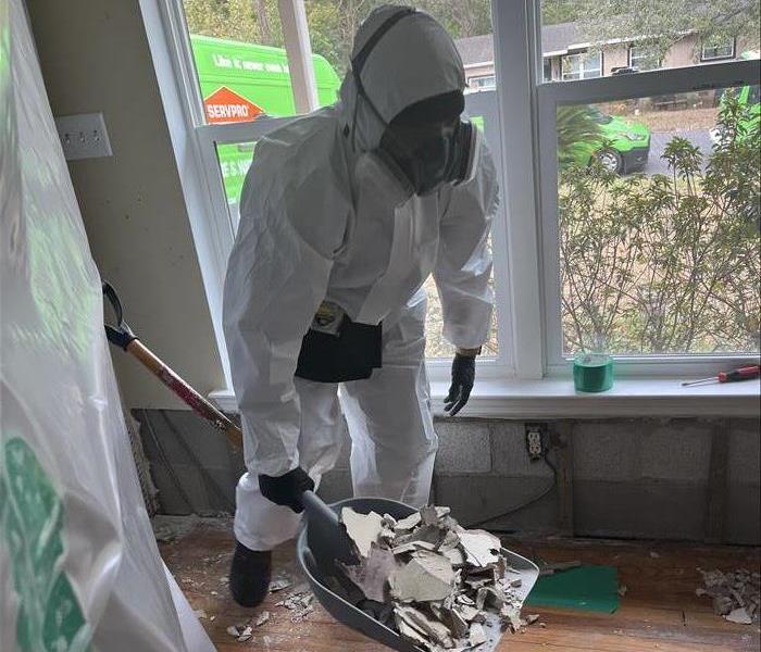 SERVPRO technician in PPE doing mold remediation work that was caused by water damage